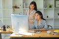 Female marketing manager looking at pc computer screen