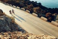 Two professional male cyclists riding their racing bicycles in the morning together Royalty Free Stock Photo