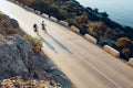 Two professional male cyclists riding their racing bicycles in the morning together Royalty Free Stock Photo