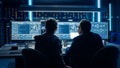 Two Professional IT Programers Discussing Blockchain Data Network Architecture Design and Developm Royalty Free Stock Photo