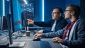 Two Professional IT Programers Discussing Blockchain Data Network Architecture Design and Developm Royalty Free Stock Photo