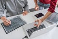 Two professional programmer cooperating and working on web site project in a software developing on desktop computer at company, Royalty Free Stock Photo