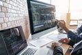 Two professional programmer cooperating and working on web site project in a software developing on desktop computer at company,