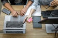 Two professional programmer cooperating and working on web site project in a software developing on desktop computer at company, Royalty Free Stock Photo