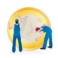 Two professionals cleaning the big Euro coin