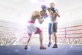 Two professionl boxers are fighting on arena Royalty Free Stock Photo