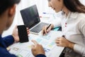 Two programmer test coding technologies with mobile phone for comparing mobile and desktop website. User experience concept
