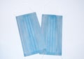 Two protective face medical masks. medical blue protective bandage against coronavirus  on a white background Royalty Free Stock Photo