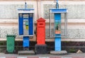 Two public phone booth with mail box and green bin Royalty Free Stock Photo