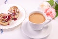 Two puff pastry cakes on a table with a cup of coffee Royalty Free Stock Photo
