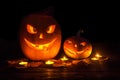 Two pumpkin jack-o-lantern with smiles carved on Halloween with Royalty Free Stock Photo