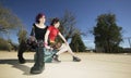 Two Punk Girls Sitting on Suitcases Royalty Free Stock Photo