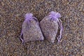 Two purple organza pouch with natural dried lavender flowers. Lavender bud dry flower sachet fragrant bag