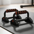 Two push-up bars are positioned on a textured black exercise mat. The bars feature Royalty Free Stock Photo