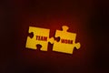 Two puzzle peaces with words Team Work almost connected together. Team building teamwork collaboration business process concept Royalty Free Stock Photo