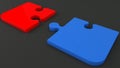 Two puzzle pieces in red and blue on black Royalty Free Stock Photo