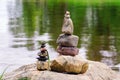 Two pyramids of stones on the lake. Ladoga skerries. Royalty Free Stock Photo