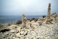 Two pyramids from stones on the seashore Royalty Free Stock Photo