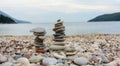 Two pyramids of stones on the seashore Royalty Free Stock Photo