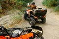 Two quad bike riders travels in forest, front view Royalty Free Stock Photo