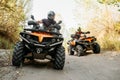 Two quad bike riders travels in forest, front view Royalty Free Stock Photo
