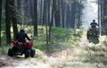 Two quads in forest (ATV) Royalty Free Stock Photo