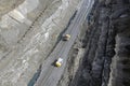 Two quarry dump trucks at the bottom of the quarry Royalty Free Stock Photo