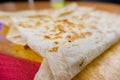 Quesadillas and a slice of lime on a cutting board