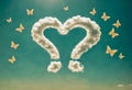 Two question marks in form of heart on blue sky Royalty Free Stock Photo
