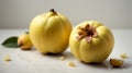 Two quinces close-up on a white.