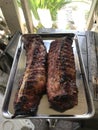 Two racks of fresh cooked baby back ribs