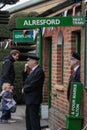 Two railway guards or inspectors on railway platform