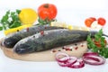 Two rainbow trouts with herbs and peppercorns Royalty Free Stock Photo