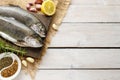 Two rainbow trouts on rustic wooden table Royalty Free Stock Photo