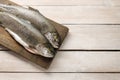 Two rainbow trouts on rustic wooden table Royalty Free Stock Photo