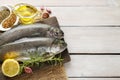 Two rainbow trouts on rustic wooden table Royalty Free Stock Photo