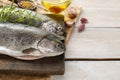 Two rainbow trouts on rustic wooden table Royalty Free Stock Photo
