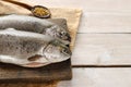 Two rainbow trouts on rustic wooden table Royalty Free Stock Photo