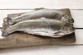 Two rainbow trouts on rustic wooden table Royalty Free Stock Photo
