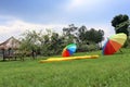 Two Rainbow Umbrellas are set above the beautiful garden