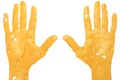 Two raised hands carved out of cheese, a sign of help or surrender on a white isolated background