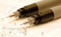 Two rapitographs lying on drawing table Royalty Free Stock Photo