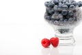 Two raspberries with blueberries bowl