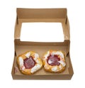 Two raspberry danish in a cardboard box Royalty Free Stock Photo