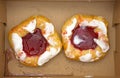 Two raspberry danish in cardboard box Royalty Free Stock Photo