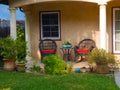 Two rattan  chairs in the front porch Royalty Free Stock Photo