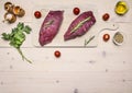 Two raw beef steak with parsley, rosemary and spices on wooden rustic background top view border ,place text Royalty Free Stock Photo