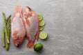 Two raw red tilapia fish cooking Royalty Free Stock Photo