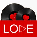 Two Realistic Black Vinyl Records with red heart labels in a bright cover with word love and play button. Retro Sound Carrier on Royalty Free Stock Photo