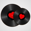 Two Realistic Black Vinyl Records with red heart labels. Retro Sound Carriers isolated on white background Royalty Free Stock Photo
